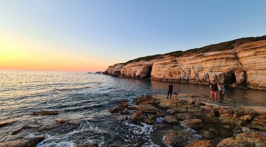  A hidden coastal area surrounded by natural rock formations and caves, offering a more private and scenic atmosphere.