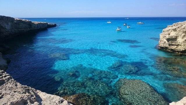  A hidden bay with dramatic cliffs and deep blue water, adding adventure and mystery to your yacht experience.